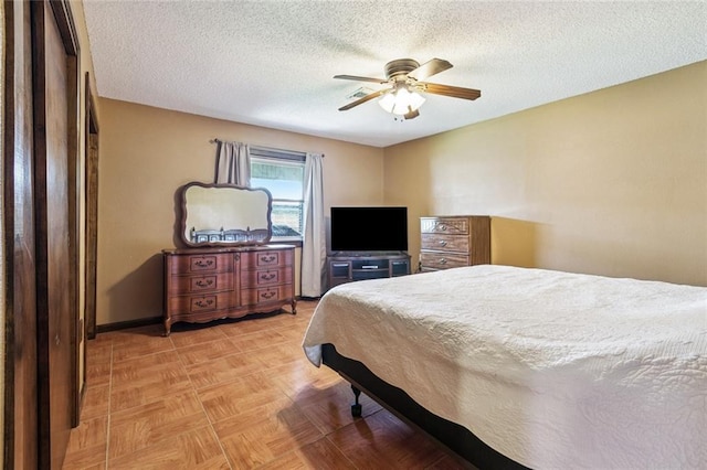 4520 13th St, Marrero, LA 70072 - bedroom with a textured ceiling and a ceiling fan