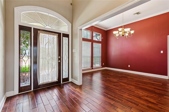 142 Colony Rd, Belle Chasse, LA 70037 - foyer with a chandelier, wood finished floors, and ornamental molding
