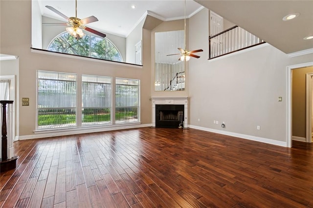142 Colony Rd, Belle Chasse, LA 70037 - unfurnished living room with ceiling fan, healthy amount of natural light, hardwood / wood-style flooring, ornamental molding, and high vaulted ceiling