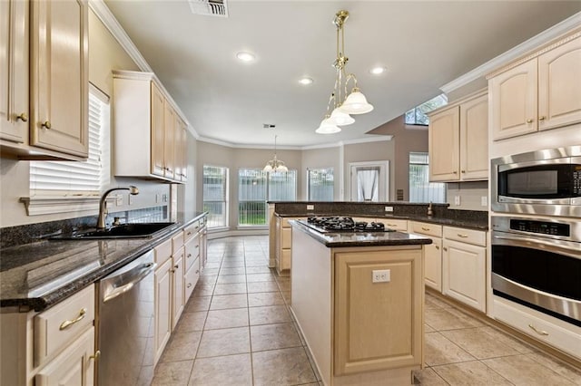 142 Colony Rd, Belle Chasse, LA 70037 - kitchen with stainless steel appliances, a chandelier, crown molding, a peninsula, and light tile patterned flooring