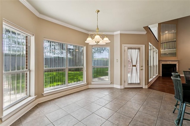 142 Colony Rd, Belle Chasse, LA 70037 - unfurnished dining area featuring a chandelier, tile patterned floors, ornamental molding, and a fireplace