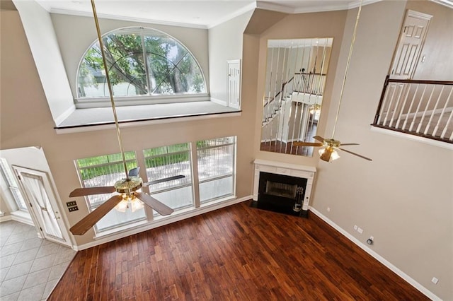 142 Colony Rd, Belle Chasse, LA 70037 - living area with a ceiling fan, ornamental molding, wood finished floors, and a fireplace with flush hearth