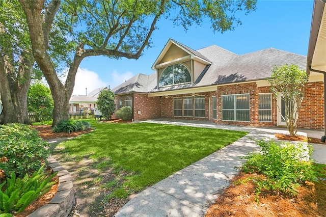 142 Colony Rd, Belle Chasse, LA 70037 - back of property featuring brick siding and a lawn