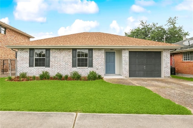 4809 N Park Dr, Metairie, LA 70001 - ranch-style home featuring a garage, driveway, a shingled roof, and brick siding