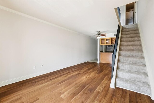 3805 Houma Blvd Unit B221, Metairie, LA 70006 - stairs featuring a ceiling fan, crown molding, and wood finished floors