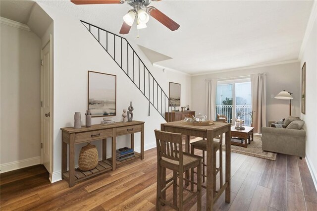 3805 Houma Blvd Unit B221, Metairie, LA 70006 - dining space featuring ceiling fan, stairway, wood finished floors, and ornamental molding