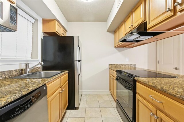 3805 Houma Blvd Unit B221, Metairie, LA 70006 - kitchen featuring appliances with stainless steel finishes, under cabinet range hood, stone countertops, and light tile patterned flooring