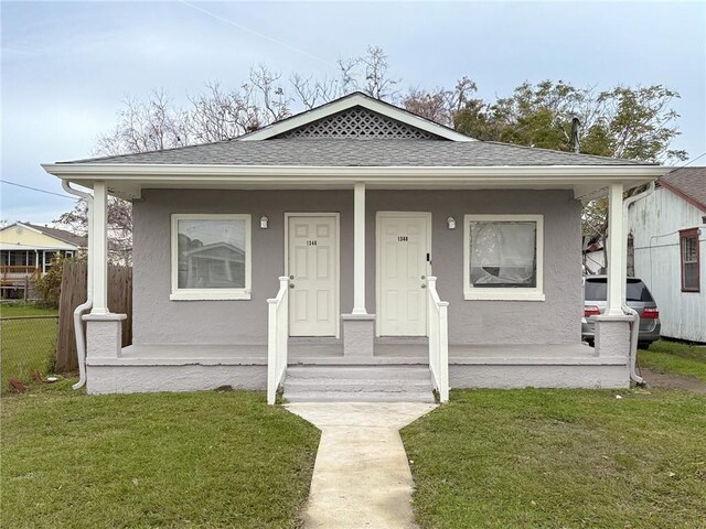 134648 S Dilton St, Metairie, LA 70003 - bungalow-style home with roof with shingles, a porch, and stucco siding