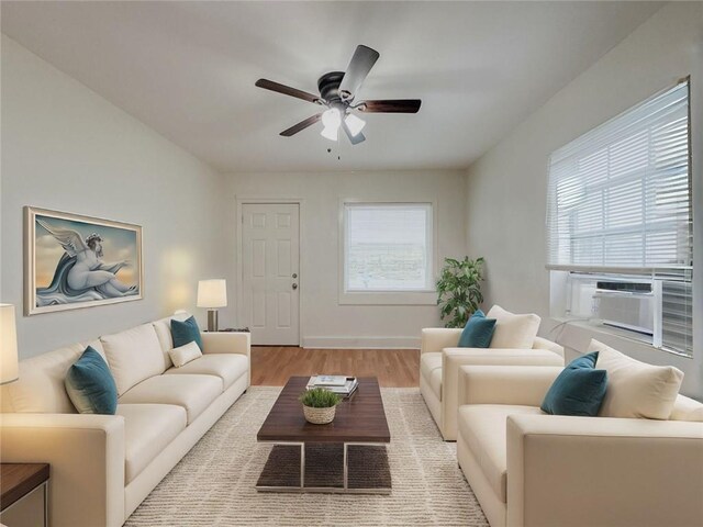 134648 S Dilton St, Metairie, LA 70003 - living area with ceiling fan, light wood-style floors, and cooling unit