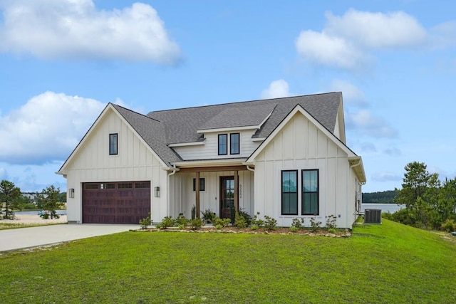52554 Shore Dr, Franklinton, LA 70438 - modern farmhouse style home with a shingled roof, board and batten siding, a front lawn, concrete driveway, and a garage