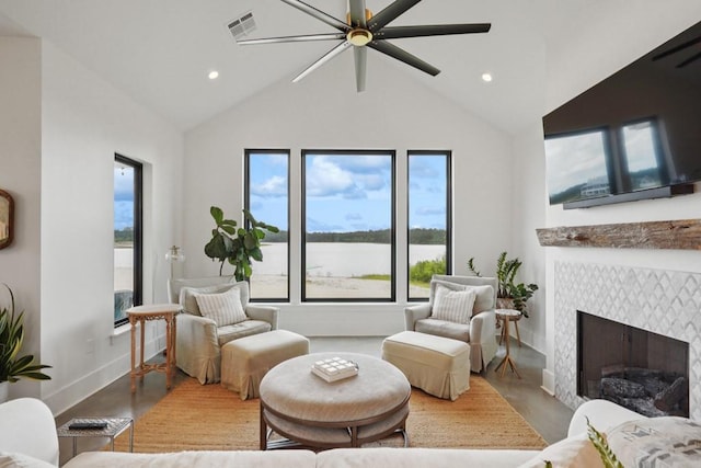 52554 Shore Dr, Franklinton, LA 70438 - living room featuring wood finished floors, a ceiling fan, vaulted ceiling, a tile fireplace, and recessed lighting