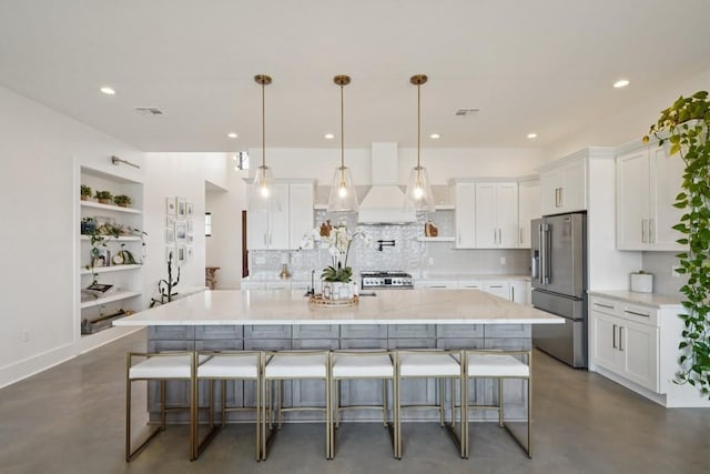 52554 Shore Dr, Franklinton, LA 70438 - kitchen with high quality fridge, custom range hood, concrete flooring, tasteful backsplash, and white cabinets