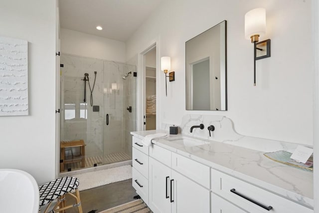52554 Shore Dr, Franklinton, LA 70438 - bathroom with a stall shower, vanity, a spacious closet, a freestanding bath, and recessed lighting