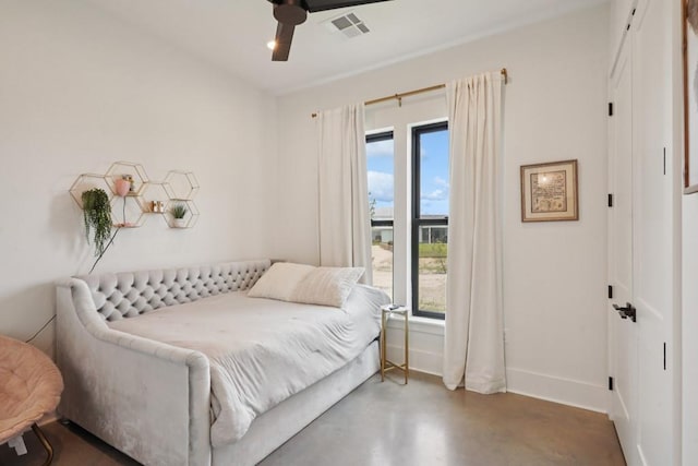 52554 Shore Dr, Franklinton, LA 70438 - bedroom with concrete flooring and a ceiling fan