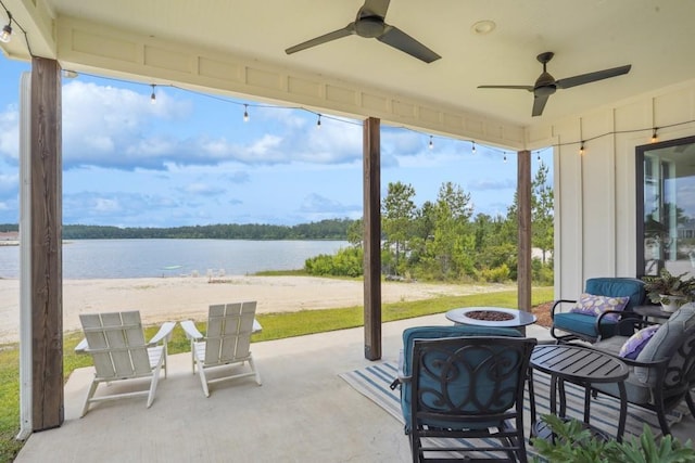 52554 Shore Dr, Franklinton, LA 70438 - view of patio with a fire pit, ceiling fan, and a water view