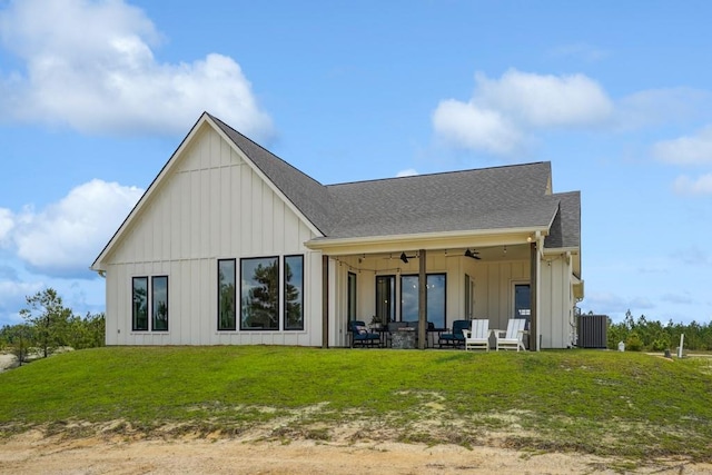 52554 Shore Dr, Franklinton, LA 70438 - rear view of property featuring a ceiling fan, outdoor lounge area, board and batten siding, a lawn, and roof with shingles