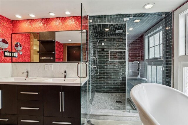 1919 Robert St, New Orleans, LA 70115 - full bath featuring recessed lighting, a freestanding bath, a stall shower, and double vanity