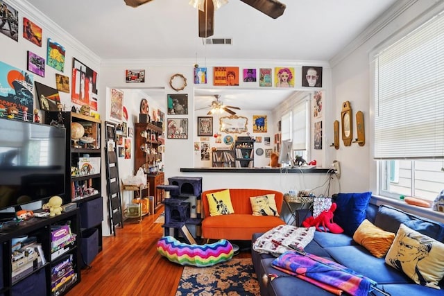432426 Banks St, New Orleans, LA 70119 - living area featuring ceiling fan, wood finished floors, and crown molding