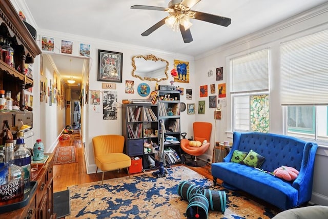 432426 Banks St, New Orleans, LA 70119 - living area with crown molding, wood finished floors, and ceiling fan