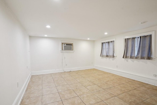 432426 Banks St, New Orleans, LA 70119 - finished below grade area with a wall mounted air conditioner, recessed lighting, and light tile patterned flooring