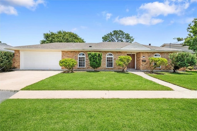 4013 Taft Park, Metairie, LA 70002 - single story home with a front yard, concrete driveway, an attached garage, and brick siding