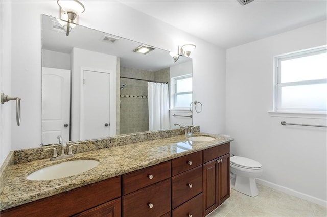 4013 Taft Park, Metairie, LA 70002 - full bathroom with double vanity, a tile shower, and tile patterned flooring