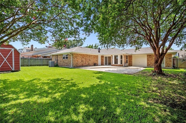 4013 Taft Park, Metairie, LA 70002 - back of house with brick siding, a garage, a storage unit, and a patio area