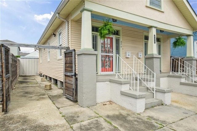 62426 9th St, New Orleans, LA 70115 - doorway to property featuring stucco siding