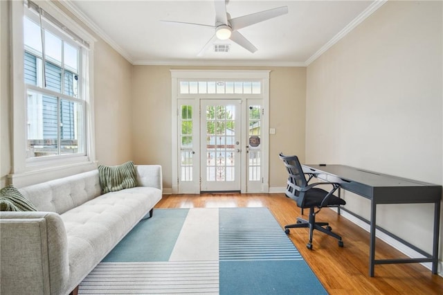 62426 9th St, New Orleans, LA 70115 - home office featuring wood finished floors, crown molding, and a ceiling fan