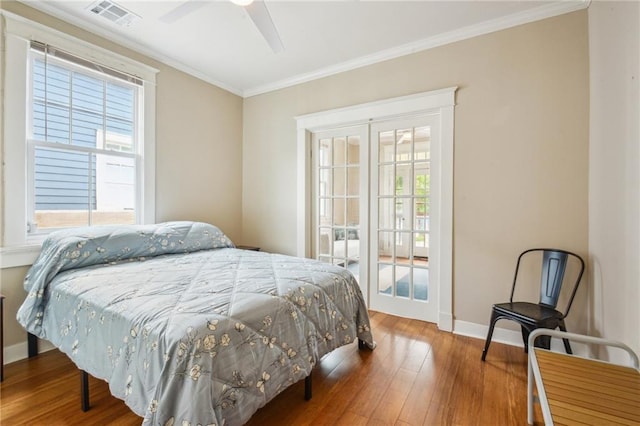 62426 9th St, New Orleans, LA 70115 - bedroom featuring multiple windows, hardwood / wood-style flooring, crown molding, access to outside, and ceiling fan
