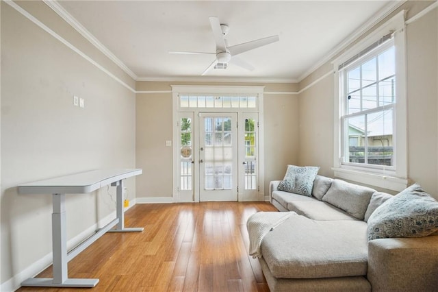 62426 9th St, New Orleans, LA 70115 - sitting room with light wood-type flooring, ornamental molding, and a ceiling fan