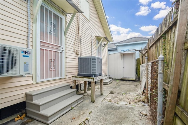 62426 9th St, New Orleans, LA 70115 - fenced backyard featuring entry steps, a patio, and a shed