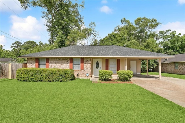 601 Jw Davis Dr, Hammond, LA 70403 - ranch-style home featuring driveway, brick siding, an attached carport, and roof with shingles