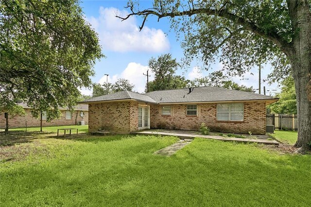 601 Jw Davis Dr, Hammond, LA 70403 - back of house with brick siding, french doors, and a patio