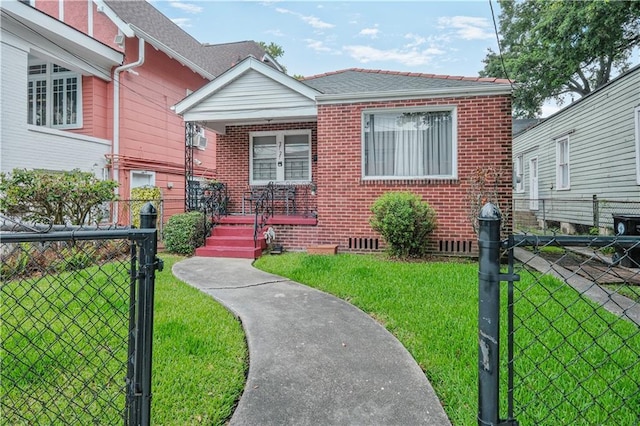 2727 Carondelet St, New Orleans, LA 70130 - view of front of house with brick siding, covered porch, and a gate