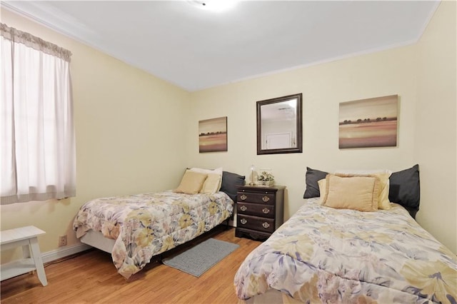 2727 Carondelet St, New Orleans, LA 70130 - bedroom featuring wood finished floors and crown molding
