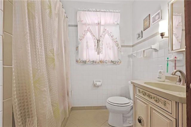 2727 Carondelet St, New Orleans, LA 70130 - bathroom with tile walls, vanity, tile patterned flooring, and a shower with curtain