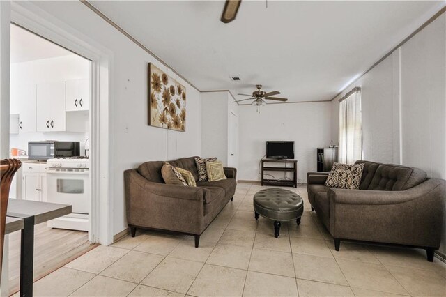 2727 Carondelet St, New Orleans, LA 70130 - living area with a ceiling fan and light tile patterned floors