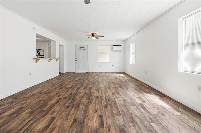 564 Mathew St, Lafitte, LA 70067 - unfurnished living room with ceiling fan, wood finished floors, a wall mounted AC, and ornamental molding