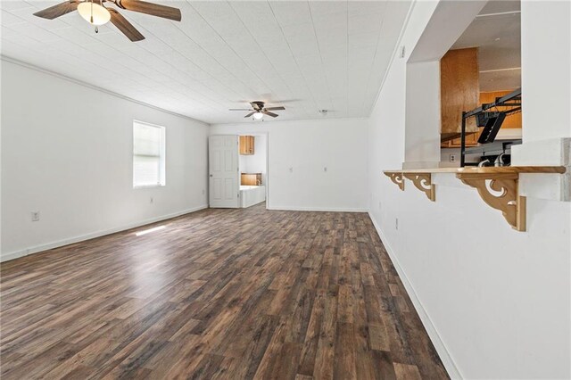 564 Mathew St, Lafitte, LA 70067 - unfurnished living room featuring a ceiling fan and wood finished floors