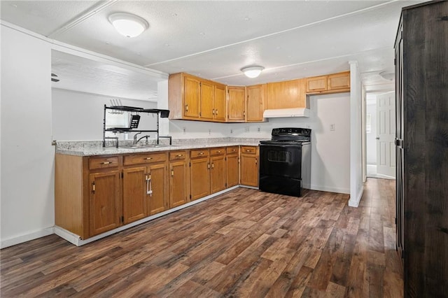 564 Mathew St, Lafitte, LA 70067 - kitchen featuring black range with electric cooktop, ventilation hood, dark wood-type flooring, and brown cabinets