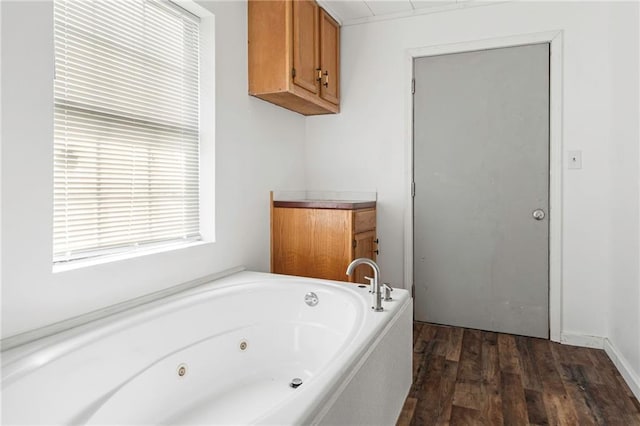 564 Mathew St, Lafitte, LA 70067 - bathroom with a jetted tub and wood finished floors