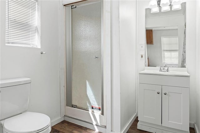 564 Mathew St, Lafitte, LA 70067 - full bathroom featuring a stall shower, vanity, and wood finished floors