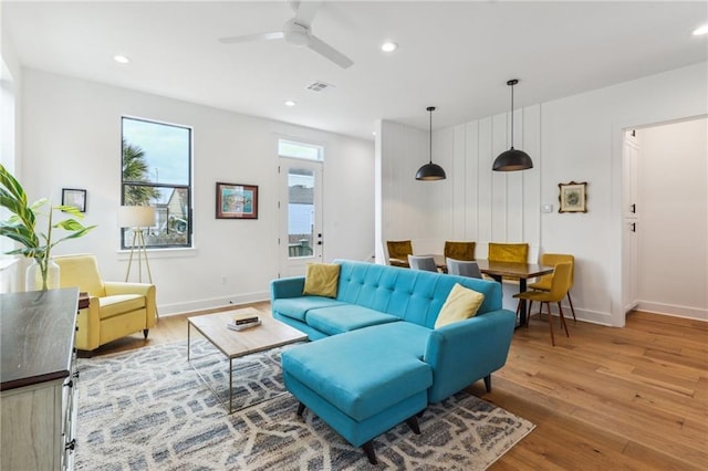 810 N Roman St, New Orleans, LA 70116 - living room with wood finished floors, a ceiling fan, and recessed lighting