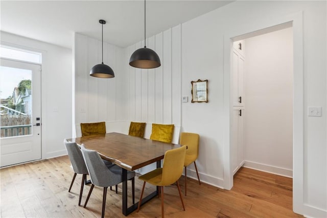 810 N Roman St, New Orleans, LA 70116 - dining room featuring light wood-style flooring and baseboards