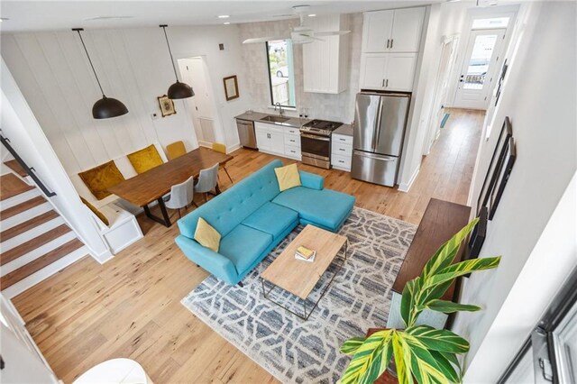 810 N Roman St, New Orleans, LA 70116 - living room with light wood-type flooring and ceiling fan