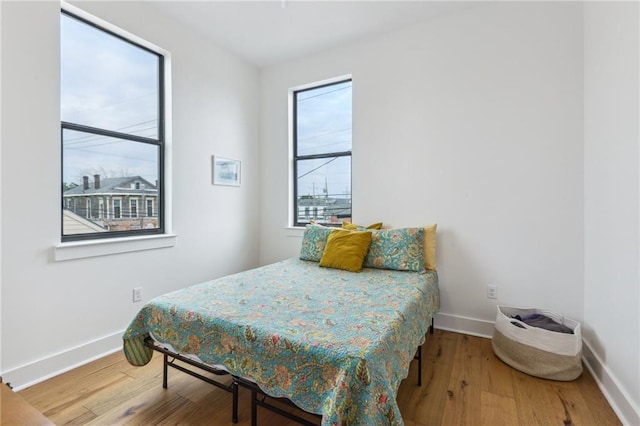 810 N Roman St, New Orleans, LA 70116 - bedroom featuring wood finished floors and baseboards
