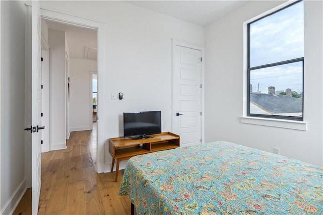 810 N Roman St, New Orleans, LA 70116 - bedroom featuring light wood-style flooring and baseboards