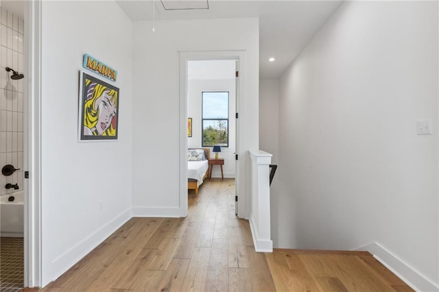 810 N Roman St, New Orleans, LA 70116 - hall with light wood finished floors, attic access, an upstairs landing, and recessed lighting