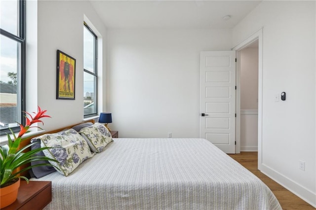 810 N Roman St, New Orleans, LA 70116 - bedroom with wood finished floors and baseboards